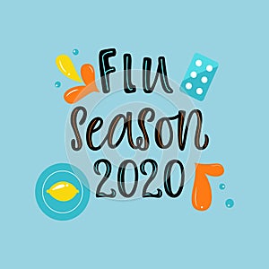 Handwritten FLU SEASON 2020 with varios means and mediciness on blue background photo